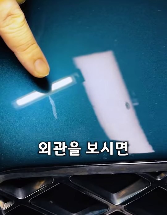 중카TV 영상에서 G80 외관 도장을 가리키는 장면